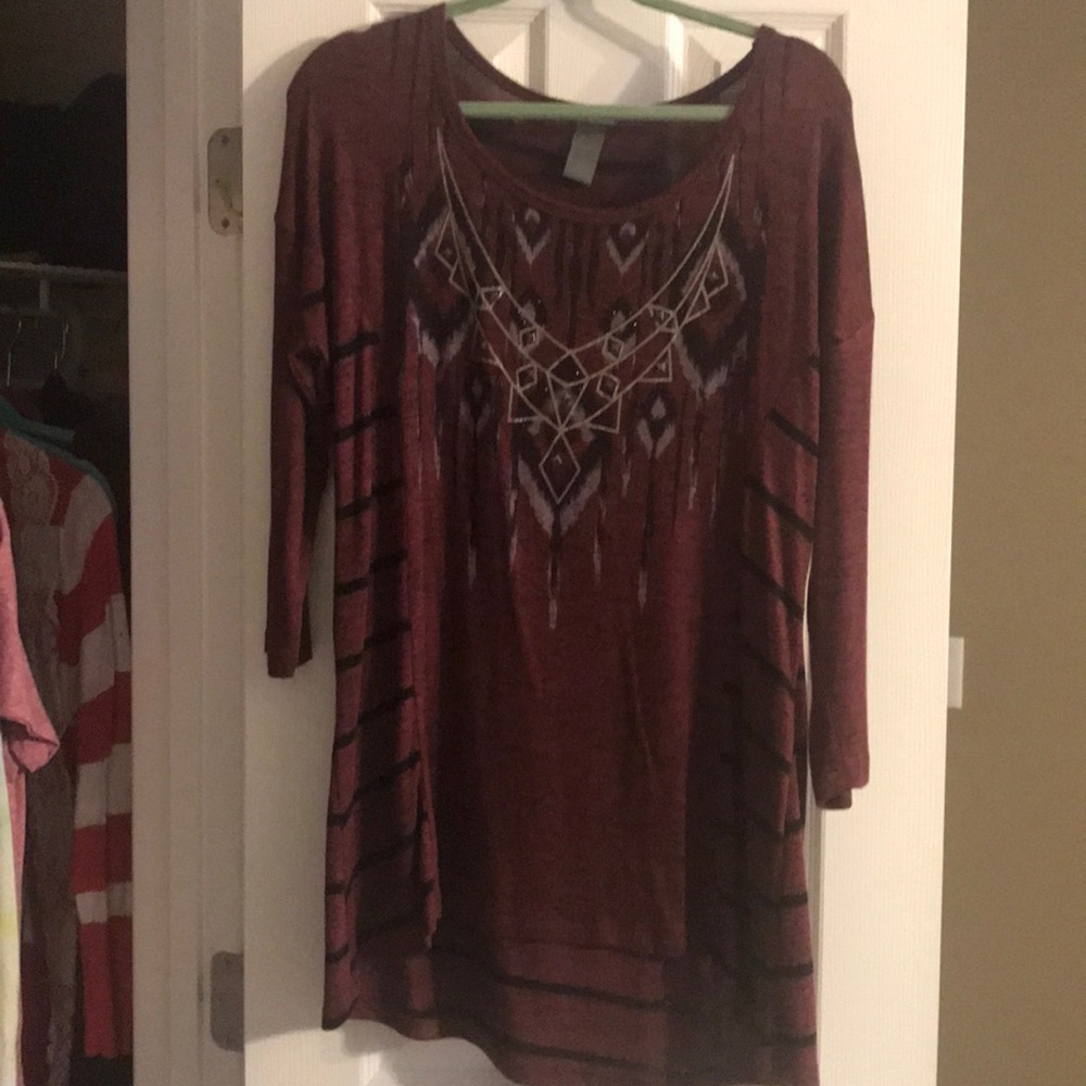 Maroon blouse with design.
